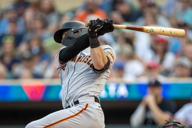 May 23, 2023; Minneapolis, Minnesota, USA; San Francisco Giants left fielder Mitch Haniger (17) hits a single in the second inning against the Minnesota Twins at Target Field. Mandatory Credit: Jesse Johnson-USA TODAY Sports