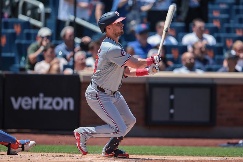 Jul 11, 2024; New York City, New York, USA; Washington Nationals right fielder Lane Thomas (28) singles during the first inning against the New York Mets at Citi Field. Mandatory Credit: Vincent Carchietta-USA TODAY Sports