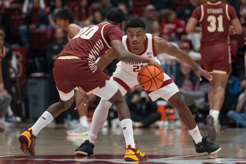 Feb 26, 2025; Stanford, California, USA;  Stanford Cardinal guard Jaylen Blakes (21) defends against Boston College Eagles guard Chas Kelley III (00) during the first half at Maples Pavilion. Mandatory Credit: Stan Szeto-Imagn Images