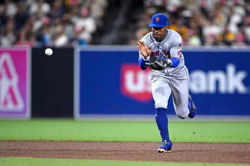 Aug 22, 2024; San Diego, California, USA; New York Mets shortstop Francisco Lindor (12) fields a ground ball during the sixth inning against the San Diego Padres at Petco Park. Mandatory Credit: Orlando Ramirez-USA TODAY Sports