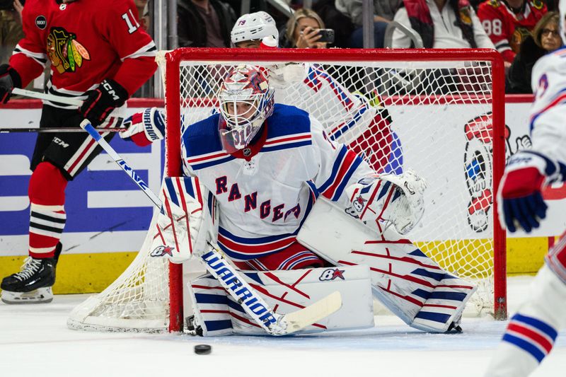 Feb 9, 2024; Chicago, Illinois, USA; New York Rangers goaltender Igor Shesterkin (31) watches the puck against the Chicago Blackhawks during the first period at the United Center. Mandatory Credit: Daniel Bartel-USA TODAY Sports