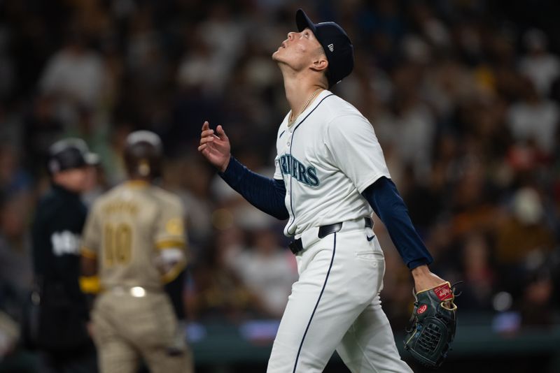 Sep 11, 2024; Seattle, Washington, USA;  Seattle Mariners starting pitcher reacts as he walks off the field during the fourth inning against the San Diego Padres at T-Mobile Park. Mandatory Credit: Stephen Brashear-Imagn Images