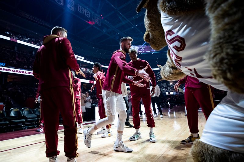 CLEVELAND, OH - APRIL 09: Dean Wade #32 of the Cleveland Cavaliers high fives his teammates during play announcements before the start of the game against the Charlotte Hornets at Rocket Mortgage Fieldhouse on April 9, 2023 in Cleveland, Ohio. The Hornets beat the Cavaliers 106-95. NOTE TO USER: User expressly acknowledges and agrees that, by downloading and/or using this Photograph, user is consenting to the terms and conditions of the Getty Images License Agreement. (Photo by Lauren Leigh Bacho/Getty Images)