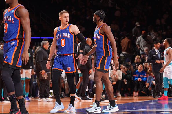 NEW YORK, NY - NOVEMBER 28: Donte Divincenzo #0 and Immanuel Quickley #5 of the New York Knicks high five during the game against the Charlotte Hornets during the In-Season Tournament on November 28, 2023 at Madison Square Garden in New York City, New York.  NOTE TO USER: User expressly acknowledges and agrees that, by downloading and or using this photograph, User is consenting to the terms and conditions of the Getty Images License Agreement. Mandatory Copyright Notice: Copyright 2023 NBAE  (Photo by Jesse D. Garrabrant/NBAE via Getty Images)