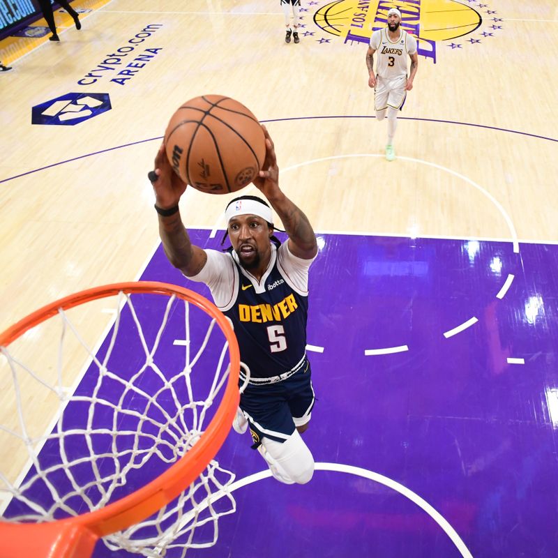 LOS ANGELES, CA - APRIL 27: Kentavious Caldwell-Pope #5 of the Denver Nuggets dunks the ball during the game against the Los Angeles Lakers during Round 1 Game 4 of the 2024 NBA Playoffs on April 27, 2024 at Crypto.Com Arena in Los Angeles, California. NOTE TO USER: User expressly acknowledges and agrees that, by downloading and/or using this Photograph, user is consenting to the terms and conditions of the Getty Images License Agreement. Mandatory Copyright Notice: Copyright 2024 NBAE (Photo by Adam Pantozzi/NBAE via Getty Images)