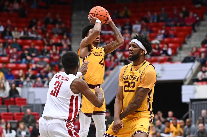 Jan 28, 2023; Pullman, Washington, USA; Arizona State Sun Devils guard Desmond Cambridge Jr. (4) shoots the ball against Washington State Cougars guard Kymany Houinsou (31) in the first half at Friel Court at Beasley Coliseum. Mandatory Credit: James Snook-USA TODAY Sports