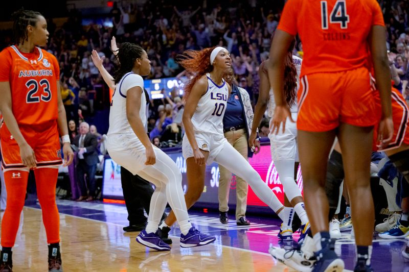 Feb 22, 2024; Baton Rouge, Louisiana, USA; LSU Lady Tigers forward Angel Reese (10) rushes to celebrate with LSU Lady Tigers guard Flau'jae Johnson (4) after she scored next to the Auburn Tigers bench at Pete Maravich Assembly Center. Mandatory Credit: Matthew Hinton-USA TODAY Sports