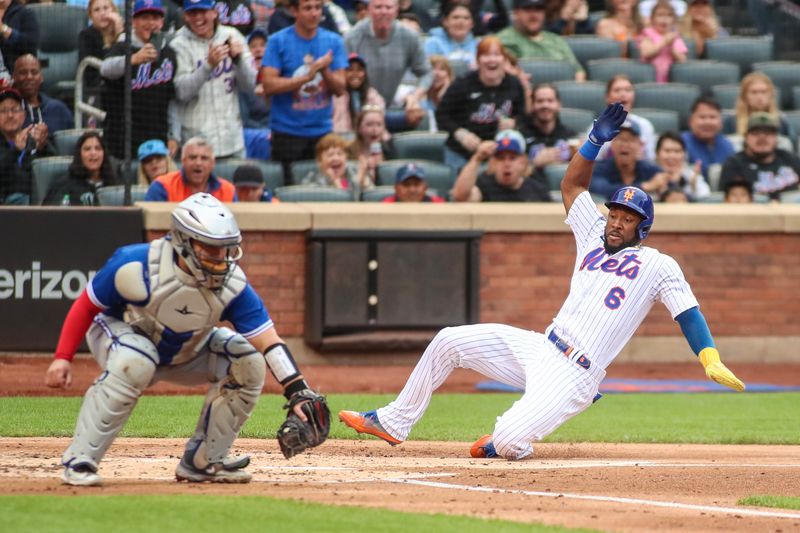 Jun 3, 2023; New York City, New York, USA;  New York Mets right fielder Starling Marte (6) slides into home to score in the second inning against the Toronto Blue Jays at Citi Field. Mandatory Credit: Wendell Cruz-USA TODAY Sports