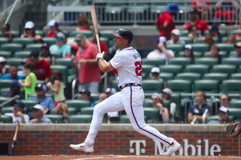 Jul 7, 2024; Atlanta, Georgia, USA; Atlanta Braves first baseman Matt Olson (28) hits a home run against the Philadelphia Phillies in the second inning at Truist Park. Mandatory Credit: Brett Davis-USA TODAY Sports
