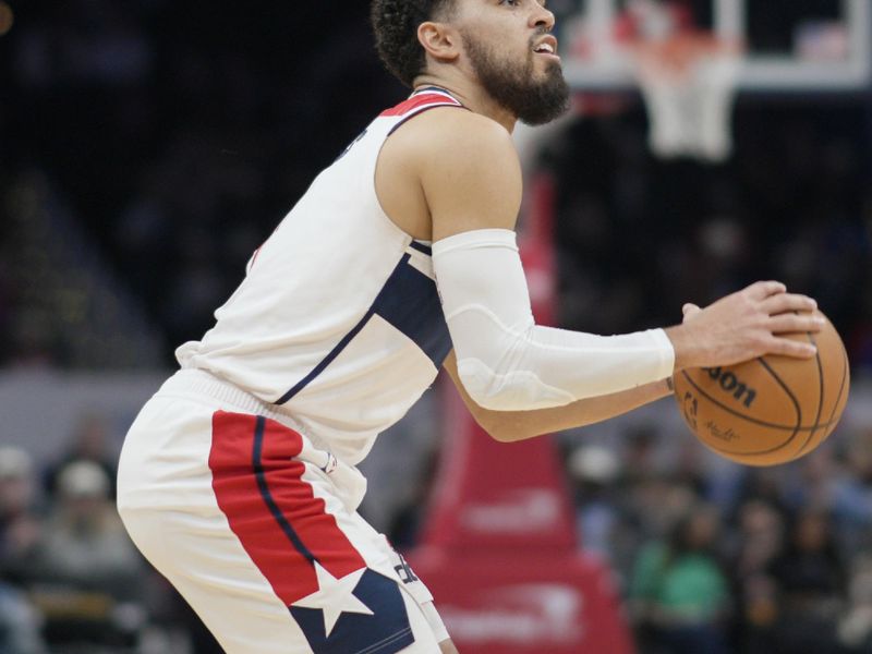 WASHINGTON, DC - JANUARY 24: Tyus Jones #5 of the Washington Wizards shoots against the Minnesota Timberwolves during the second half at Capital One Arena on January 24, 2024 in Washington, DC. NOTE TO USER: User expressly acknowledges and agrees that, by downloading and or using this photograph, User is consenting to the terms and conditions of the Getty Images License Agreement. (Photo by Jess Rapfogel/Getty Images)