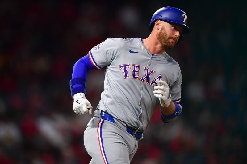 Sep 27, 2024; Anaheim, California, USA; Texas Rangers designated hitter Carson Kelly (18) runs the bases after hitting a solo home run against the Los Angeles Angels during the fourth inning at Angel Stadium. Mandatory Credit: Gary A. Vasquez-Imagn Images