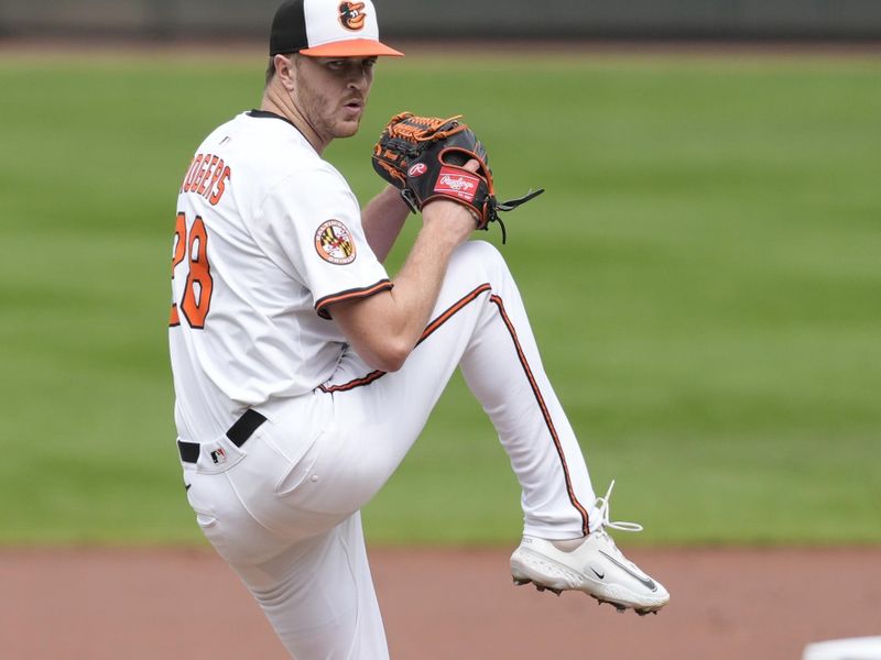 Aug 24, 2025; Baltimore, Maryland, USA; Baltimore Orioles pitcher Trevor Rogers (28) delivers a pitch against the Houston Astros during the first inning at Oriole Park at Camden Yards. Mandatory Credit: Gregory Fisher-Imagn Images