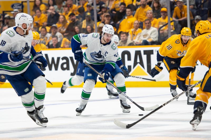 May 3, 2024; Nashville, Tennessee, USA; Vancouver Canucks defenseman Quinn Hughes (43) skates with the puck against the Nashville Predators during the second period in game six of the first round of the 2024 Stanley Cup Playoffs at Bridgestone Arena. Mandatory Credit: Steve Roberts-USA TODAY Sports