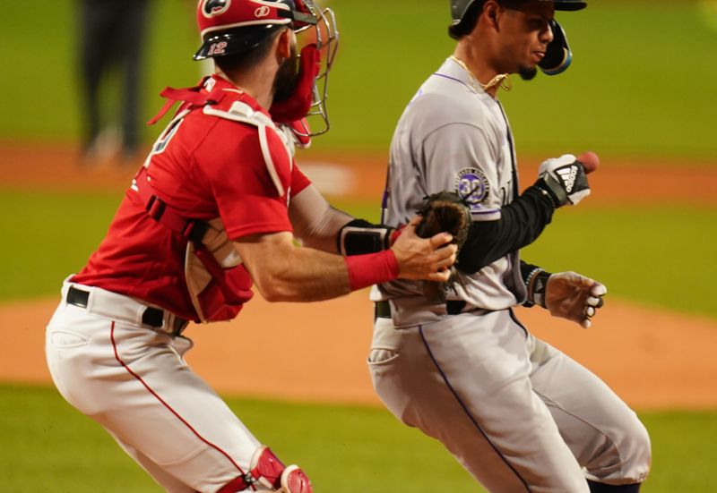 Jun 14, 2023; Boston, Massachusetts, USA; Colorado Rockies shortstop Ezequiel Tovar (14) tagged out at home plate by Boston Red Sox catcher Connor Wong (12) in the first inning at Fenway Park. Mandatory Credit: David Butler II-USA TODAY Sports