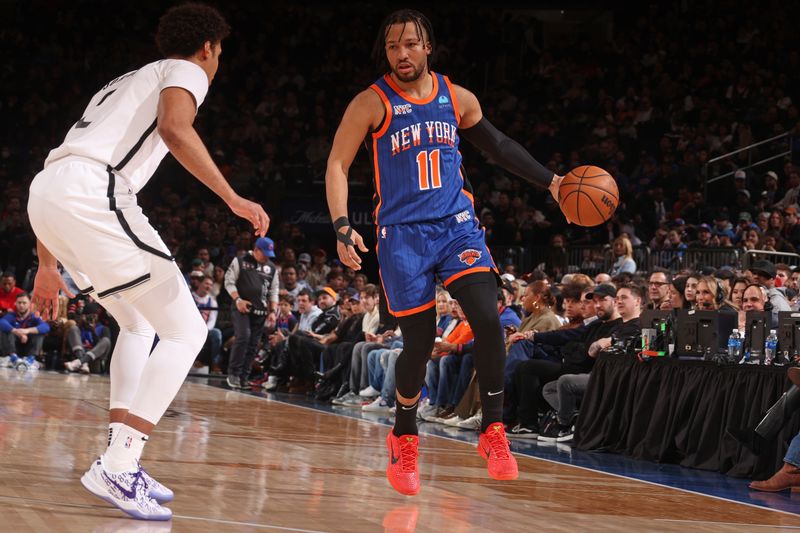 NEW YORK, NY - MARCH 23: Jalen Brunson #11 of the New York Knicks looks on during the game against the Brooklyn Nets on March 23, 2024 at Madison Square Garden in New York City, New York.  NOTE TO USER: User expressly acknowledges and agrees that, by downloading and or using this photograph, User is consenting to the terms and conditions of the Getty Images License Agreement. Mandatory Copyright Notice: Copyright 2024 NBAE  (Photo by Nathaniel S. Butler/NBAE via Getty Images)