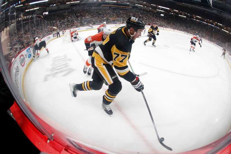 Feb 25, 2024; Pittsburgh, Pennsylvania, USA; Pittsburgh Penguins center Jeff Carter (77) moves the puck in the corner against the Philadelphia Flyers during the second period at PPG Paints Arena.  Mandatory Credit: Charles LeClaire-USA TODAY Sports