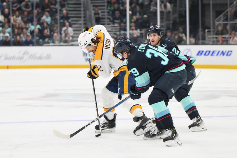 Mar 16, 2024; Seattle, Washington, USA; Nashville Predators center Tommy Novak (82) and Seattle Kraken defenseman Ryker Evans (39) play the puck during the first period at Climate Pledge Arena. Mandatory Credit: Steven Bisig-USA TODAY Sports