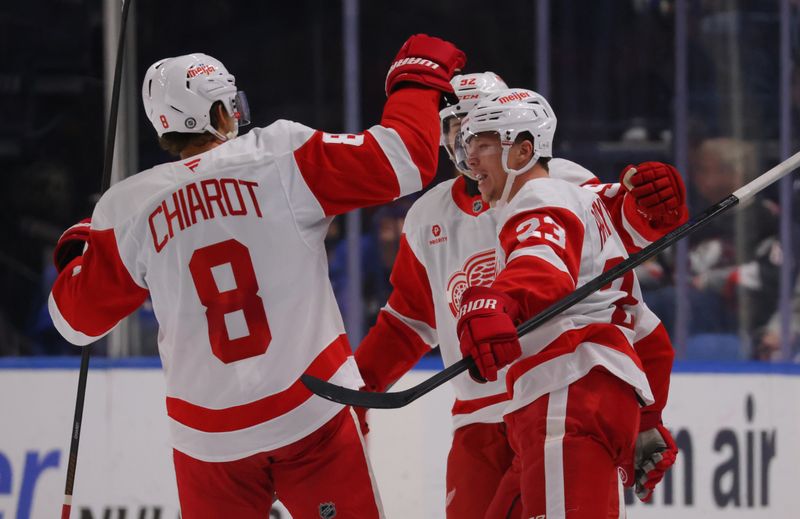 Oct 26, 2024; Buffalo, New York, USA;  Detroit Red Wings left wing Lucas Raymond (23) celebrates his shorthanded goal with teammates during the second period against the Buffalo Sabres at KeyBank Center. Mandatory Credit: Timothy T. Ludwig-Imagn Images