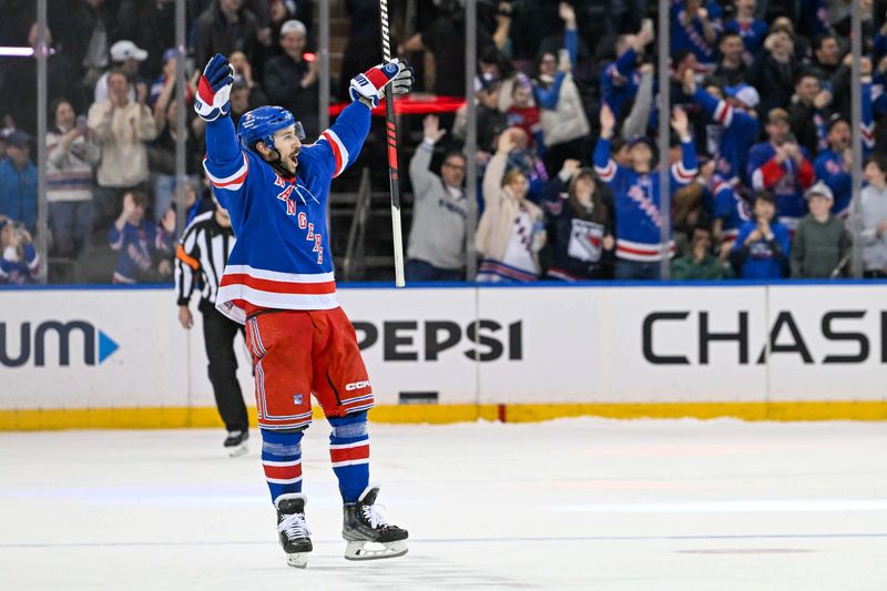 Apr 13, 2024; New York, New York, USA;  New York Rangers center Vincent Trocheck (16) celebrates after scoring the game clinching goal against the New York Islanders after shoot outs at Madison Square Garden. Mandatory Credit: Dennis Schneidler-USA TODAY Sports