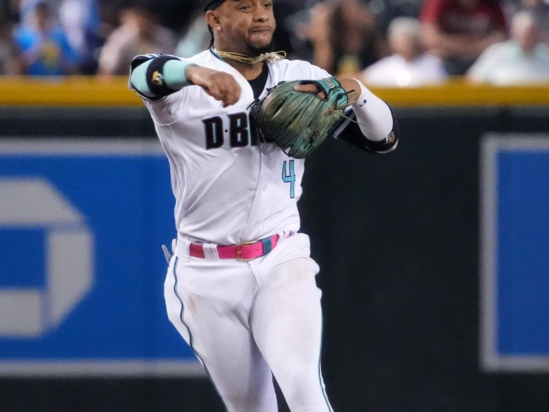 Jun 29, 2023; Phoenix, Arizona, USA; Arizona Diamondbacks second baseman Ketel Marte (4) throws to first base for the out against the Tampa Bay Rays at Chase Field. Mandatory Credit: Joe Rondone-USA TODAY Sports