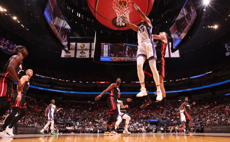 MIAMI, FL - NOVEMBER 4: Keegan Murray #13 of the Sacramento Kings dunks the ball during the game against the Miami Heat during a regular season game on November 4, 2024 at Kaseya Center in Miami, Florida. NOTE TO USER: User expressly acknowledges and agrees that, by downloading and or using this Photograph, user is consenting to the terms and conditions of the Getty Images License Agreement. Mandatory Copyright Notice: Copyright 2024 NBAE (Photo by Issac Baldizon/NBAE via Getty Images)