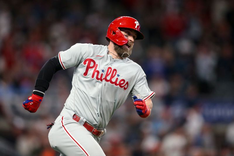 Oct 12, 2022; Atlanta, Georgia, USA; Philadelphia Phillies designated hitter Bryce Harper (3) runs the bases after hitting a double against the Atlanta Braves in the second inning during game two of the NLDS for the 2022 MLB Playoffs at Truist Park. Mandatory Credit: Brett Davis-USA TODAY Sports