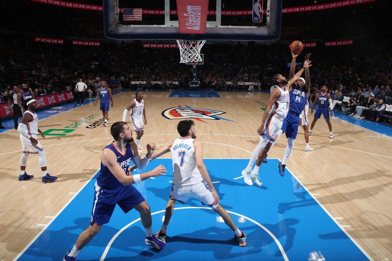 OKLAHOMA CITY, OK - FEBRUARY 22:  Terance Mann #14 of the LA Clippers shoots the ball during the game against the Oklahoma City Thunder on February 22, 2024 at Paycom Arena in Oklahoma City, Oklahoma. NOTE TO USER: User expressly acknowledges and agrees that, by downloading and or using this photograph, User is consenting to the terms and conditions of the Getty Images License Agreement. Mandatory Copyright Notice: Copyright 2024 NBAE (Photo by Zach Beeker/NBAE via Getty Images)