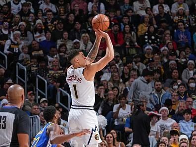 DENVER, CO - DECEMBER 25: Michael Porter Jr. #1 of the Denver Nuggets shoots the ball during the game against the Golden State Warriors on December 25, 2023 at the Ball Arena in Denver, Colorado. NOTE TO USER: User expressly acknowledges and agrees that, by downloading and/or using this Photograph, user is consenting to the terms and conditions of the Getty Images License Agreement. Mandatory Copyright Notice: Copyright 2023 NBAE (Photo by Garrett Ellwood/NBAE via Getty Images)