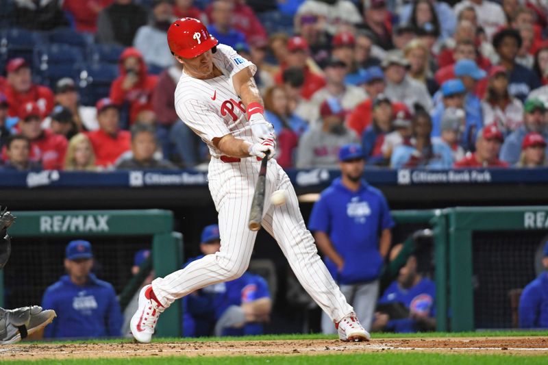 Sep 23, 2024; Philadelphia, Pennsylvania, USA; Philadelphia Phillies catcher J.T. Realmuto (10) hits a home run during the second inning against the Chicago Cubs at Citizens Bank Park. Mandatory Credit: Eric Hartline-Imagn Images