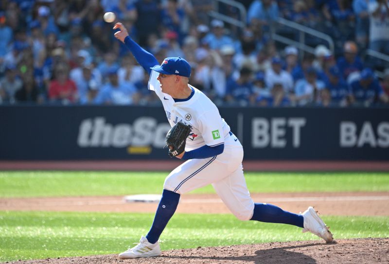 Sep 15, 2024; Toronto, Ontario, CAN;  Toronto Blue Jays relief pitcher Chad Green (57) delivers a pitch against the St. Louis Cardinals in the ninth inning at Rogers Centre. Mandatory Credit: Dan Hamilton-Imagn Images