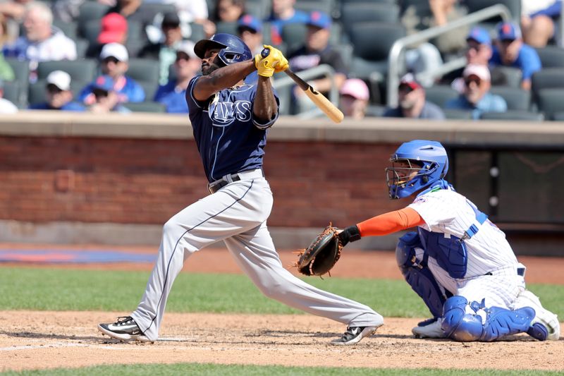 May 18, 2023; New York City, New York, USA; Tampa Bay Rays left fielder Randy Arozarena (56) follows through on a double against the New York Mets during the ninth inning at Citi Field. Mandatory Credit: Brad Penner-USA TODAY Sports