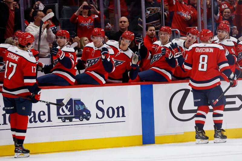 Oct 17, 2025; Washington, District of Columbia, USA; Washington Capitals center Dylan Strome (17) celebrates with teammates after scoring a goal against the Minnesota Wild during the first period at Capital One Arena. Mandatory Credit: Geoff Burke-Imagn Images