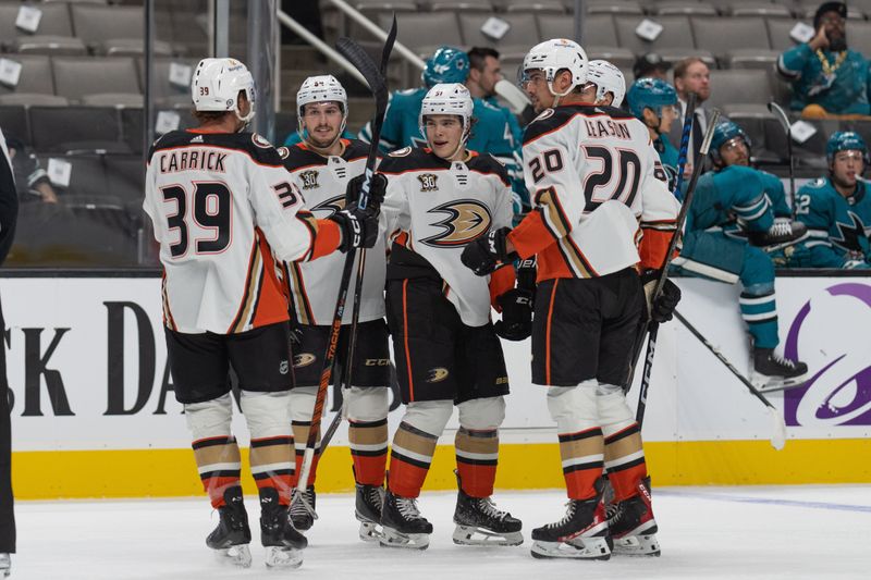 Sep 26, 2023; San Jose, California, USA; Anaheim Ducks center Sam Carrick (39) , right wing Jacob Perreault (64) ,  center Olen Zellweger (51) , center Brayden Tracey (56) and right wing Brett Leason (20) celebrate after scoring a goal during the first period against the San Jose Sharks at SAP Center at San Jose. Mandatory Credit: Stan Szeto-USA TODAY Sports