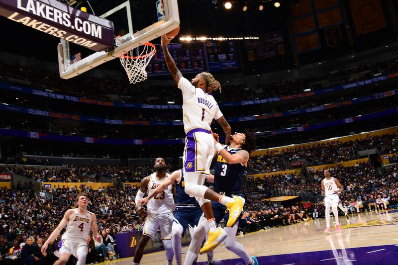 LOS ANGELES, CA - NOVEMBER 23: D'Angelo Russell #1 of the Los Angeles Lakers drives to the basket during the game against the Denver Nuggets on November 23, 2024 at Crypto.Com Arena in Los Angeles, California. NOTE TO USER: User expressly acknowledges and agrees that, by downloading and/or using this Photograph, user is consenting to the terms and conditions of the Getty Images License Agreement. Mandatory Copyright Notice: Copyright 2024 NBAE (Photo by Adam Pantozzi/NBAE via Getty Images)