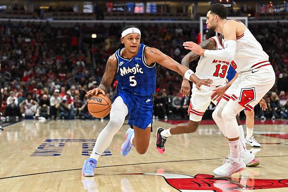 CHICAGO, ILLINOIS - NOVEMBER 15:  Paolo Banchero #5 of the Orlando Magic controls the ball against the Chicago Bulls on November 15, 2023 at United Center in Chicago, Illinois.   NOTE TO USER: User expressly acknowledges and agrees that, by downloading and or using this photograph, User is consenting to the terms and conditions of the Getty Images License Agreement.  (Photo by Jamie Sabau/Getty Images)