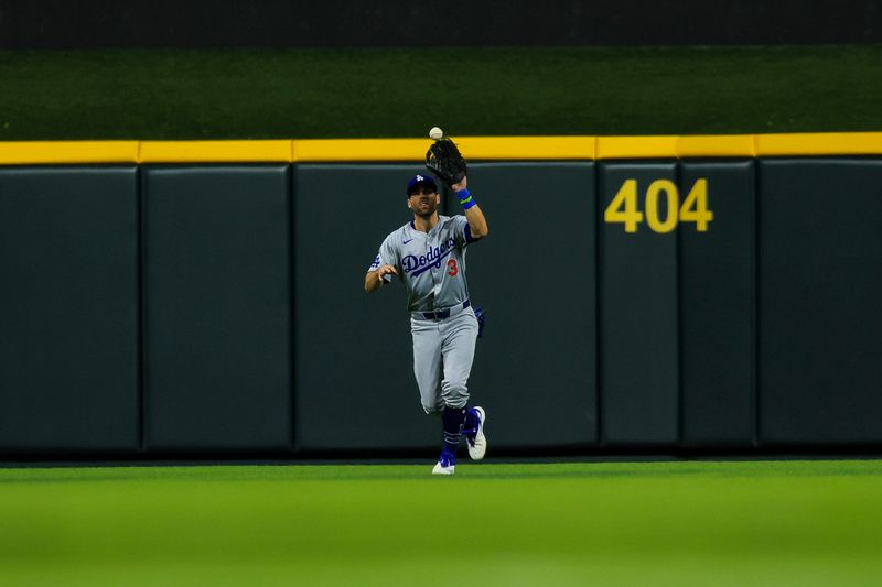 May 25, 2024; Cincinnati, Ohio, USA; Los Angeles Dodgers outfielder Chris Taylor (3) catches a pop up hit by Cincinnati Reds second baseman Jonathan India (not pictured) in the seventh inning at Great American Ball Park. Mandatory Credit: Katie Stratman-USA TODAY Sports