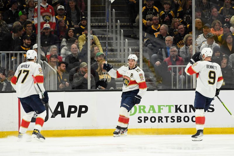 Apr 6, 2024; Boston, Massachusetts, USA; Florida Panthers left wing Matthew Tkachuk (19) reacts with defenseman Niko Mikkola (77) and center Sam Bennett (9) after scoring a goal during the first period against the Boston Bruins at TD Garden. Mandatory Credit: Bob DeChiara-USA TODAY Sports