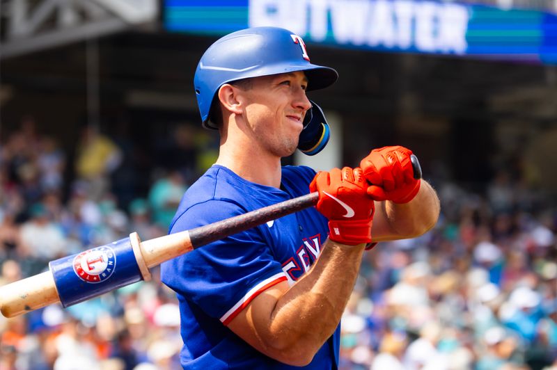 Mar 18, 2024; Surprise, Arizona, USA; Texas Rangers outfielder Wyatt Langford against the Seattle Mariners during a spring training baseball game at Surprise Stadium. Mandatory Credit: Mark J. Rebilas-USA TODAY Sports