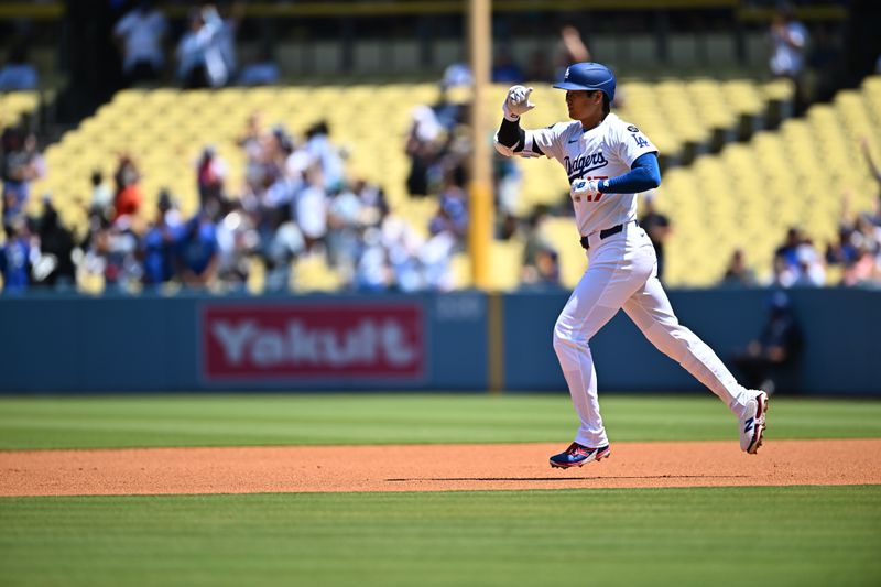 Aug 10, 2025; Los Angeles, California, USA; Los Angeles Dodgers designated hitter Shohei Ohtani (17) circles the bases after hitting a solo home run during the first inning against the Toronto Blue Jays at Dodger Stadium. Mandatory Credit: Jonathan Hui-Imagn Images