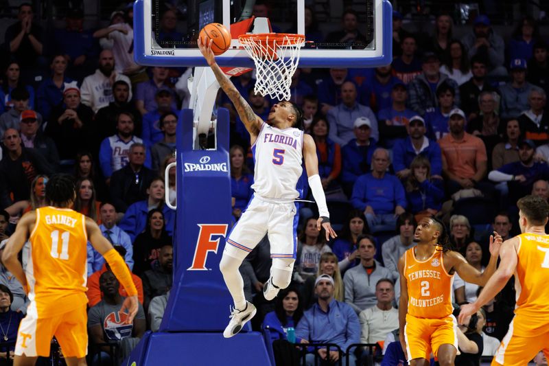 Jan 7, 2025; Gainesville, Florida, USA; Florida Gators guard Will Richard (5) makes a layup against the Tennessee Volunteers during the first half at Exactech Arena at the Stephen C. O'Connell Center. Mandatory Credit: Matt Pendleton-Imagn Images