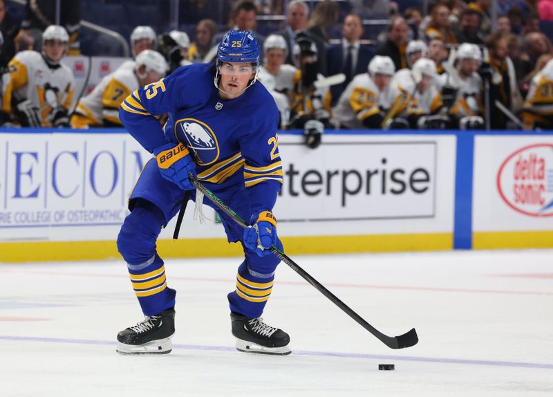 Sep 21, 2024; Buffalo, New York, USA;  Buffalo Sabres defenseman Owen Power (25) looks to make a pass during the second period against the Pittsburgh Penguins at KeyBank Center. Mandatory Credit: Timothy T. Ludwig-Imagn Images