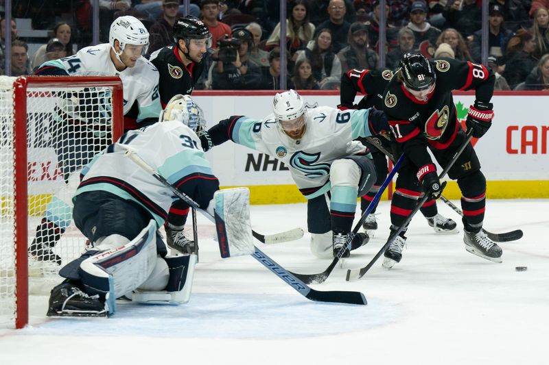 Nov 2, 2024; Ottawa, Ontario, CAN; Ottawa Senators right wing Adam Gaudette (81) moves the puck away from Seattle Kraken defenseman Adam Larsson (6) in the first period at the Canadian Tire Centre. Mandatory Credit: Marc DesRosiers-Imagn Images