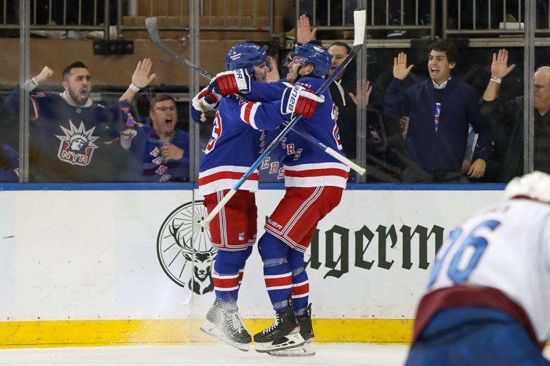 Oct 25, 2022; New York, New York, USA; New York Rangers defenseman Adam Fox (23) celebrates with New York Rangers left wing Jimmy Vesey (26) after scoring a goal against the Colorado Avalanche during the third period at Madison Square Garden. Mandatory Credit: Tom Horak-USA TODAY Sports