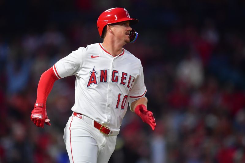 May 1, 2025; Anaheim, California, USA; Los Angeles Angels third baseman Kevin Newman (10) runs after hitting an RBI single against the Detroit Tigers during the fourth inning at Angel Stadium. Mandatory Credit: Gary A. Vasquez-Imagn Images