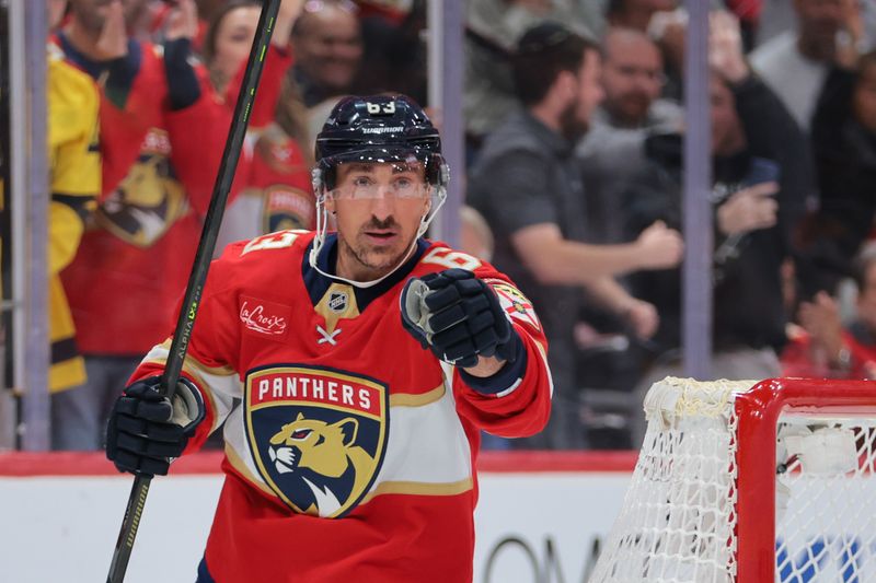 Oct 23, 2025; Sunrise, Florida, USA; Florida Panthers left wing Brad Marchand (63) celebrates after scoring against the Pittsburgh Penguins during the second period at Amerant Bank Arena. Mandatory Credit: Sam Navarro-Imagn Images