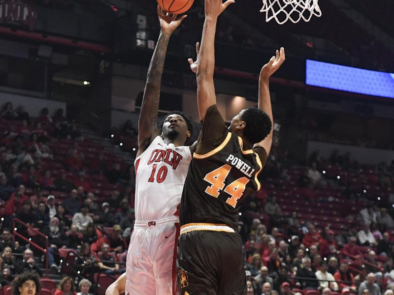 Feb 3, 2024; Las Vegas, Nevada, USA; UNLV Rebels forward Kalib Boone (10) tries to score on Wyoming Cowboys forward Caden Powell (44) in the first half at Thomas & Mack Center. Mandatory Credit: Candice Ward-USA TODAY Sports