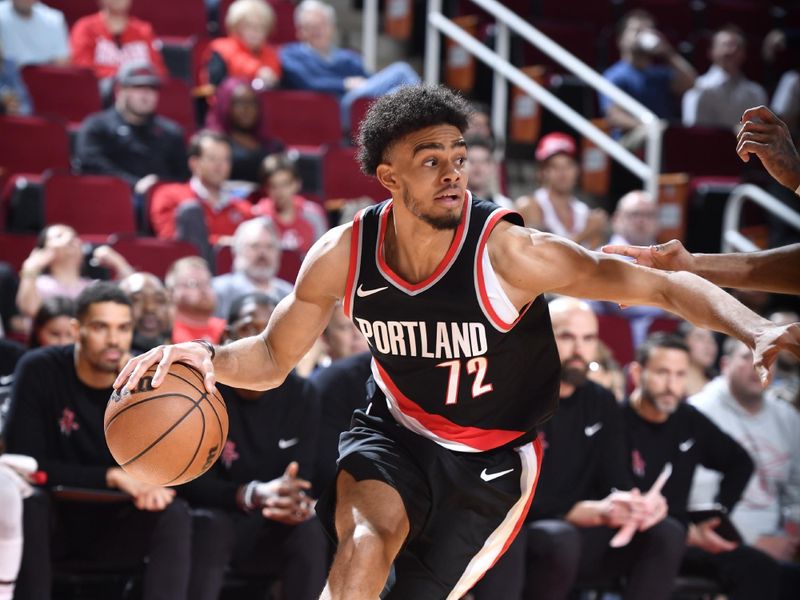 HOUSTON, TX - MARCH 25: Rayan Rupert #72 of the Portland Trail Blazers handles the ball during the game against the Houston Rockets on March 25, 2024 at the Toyota Center in Houston, Texas. NOTE TO USER: User expressly acknowledges and agrees that, by downloading and or using this photograph, User is consenting to the terms and conditions of the Getty Images License Agreement. Mandatory Copyright Notice: Copyright 2024 NBAE (Photo by Logan Riely/NBAE via Getty Images)