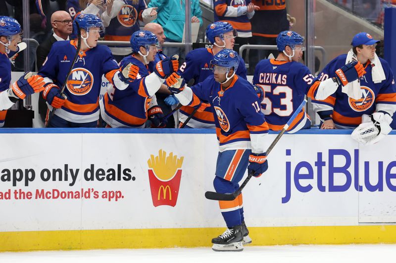 Oct 10, 2024; Elmont, New York, USA; New York Islanders left wing Anthony Duclair (11) celebrates his power play goal against the Utah Hockey Club with teammates during the first period at UBS Arena. Mandatory Credit: Brad Penner-Imagn Images