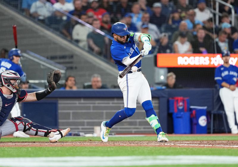 Aug 27, 2025; Toronto, Ontario, CAN; Toronto Blue Jays shortstop Bo Bichette (11) hits a single against the Minnesota Twins during the seventh inning at Rogers Centre. Mandatory Credit: Nick Turchiaro-Imagn Images