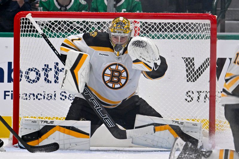 Nov 14, 2024; Dallas, Texas, USA; Boston Bruins goaltender Jeremy Swayman (1) makes a save on a Dallas Stars shot during the third period at the American Airlines Center. Mandatory Credit: Jerome Miron-Imagn Images